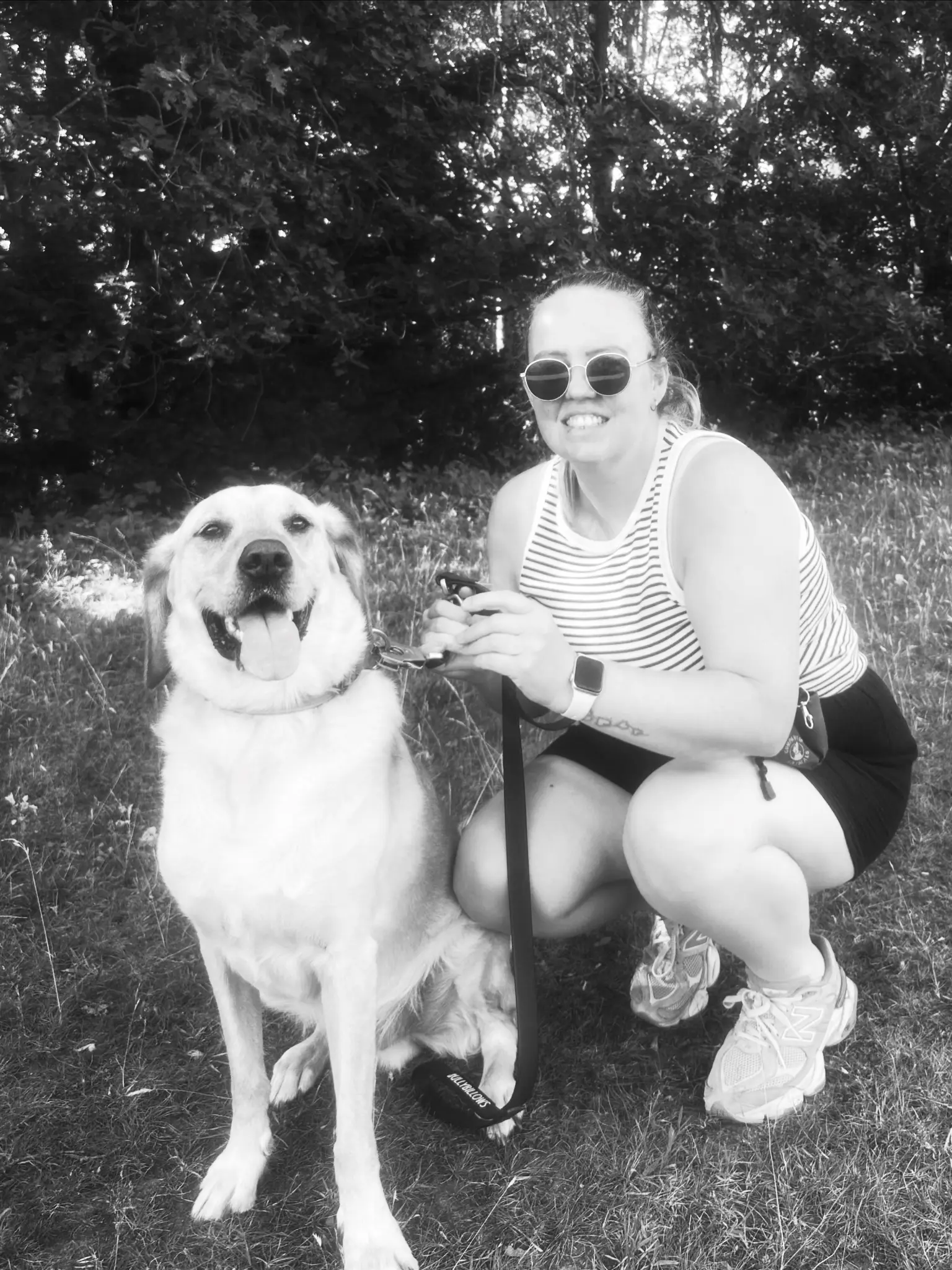 The Poppins and Paws owner sitting with a golden retriever on a local walk